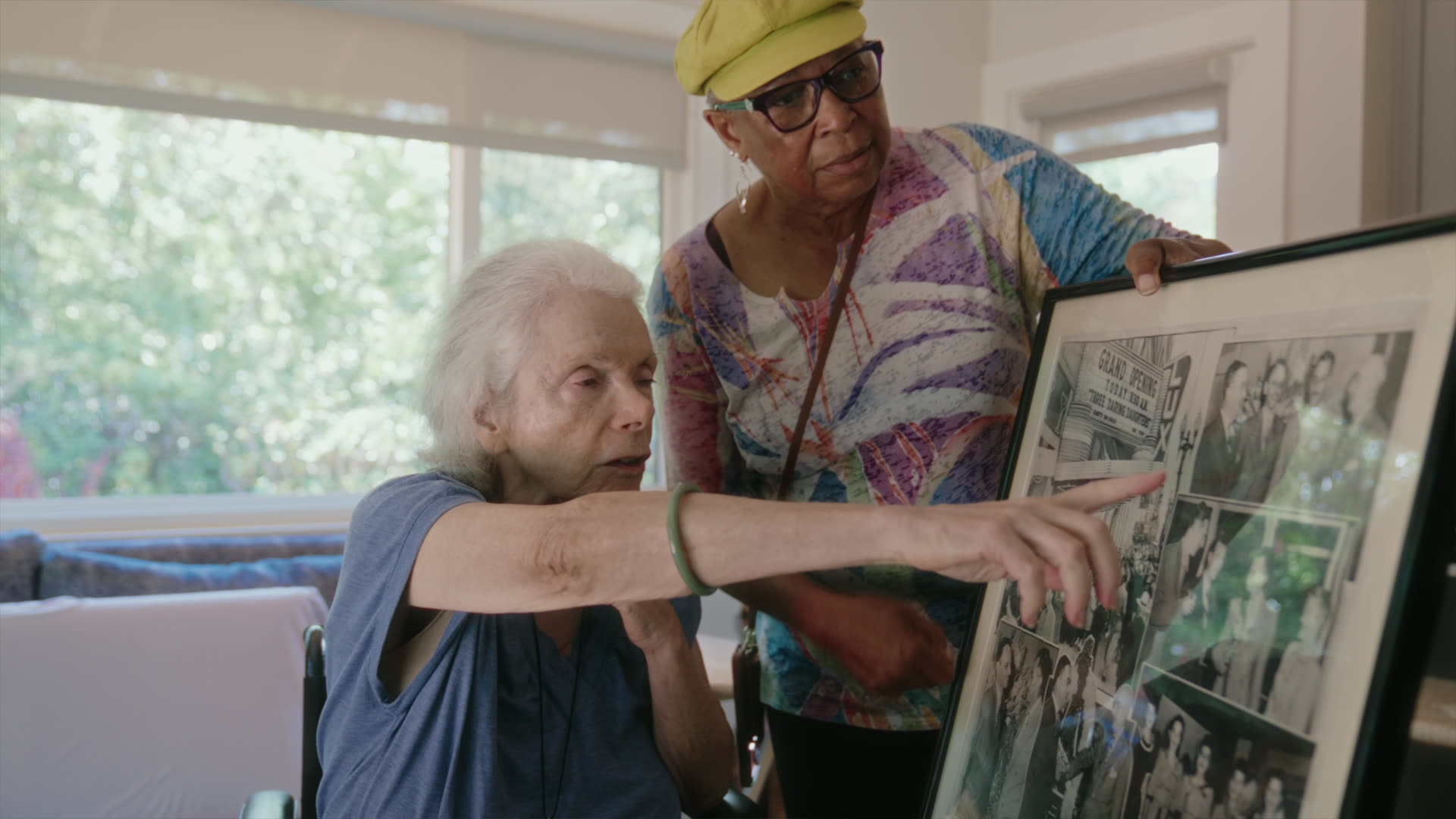 At Home Caregivers caregiver looking through photos with a client